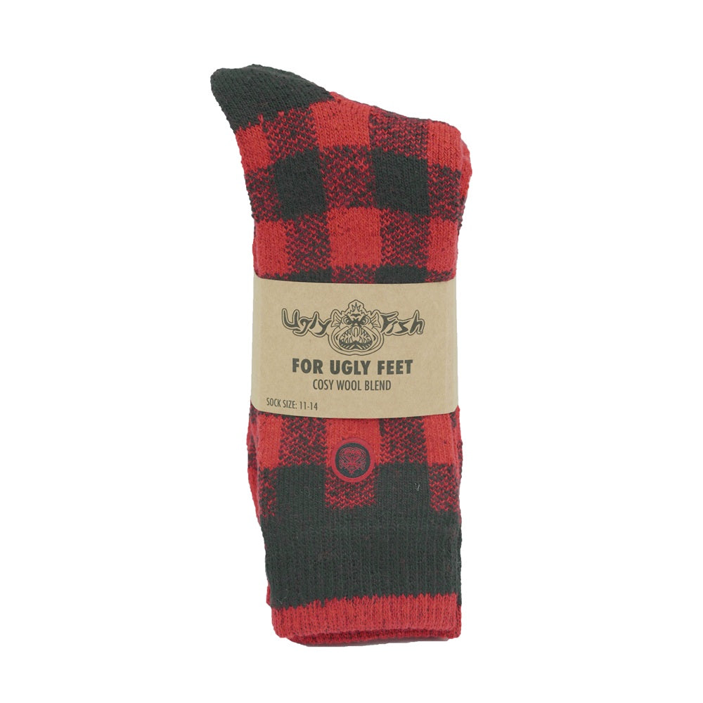 Red and black checkered sock with a brand label on a white background