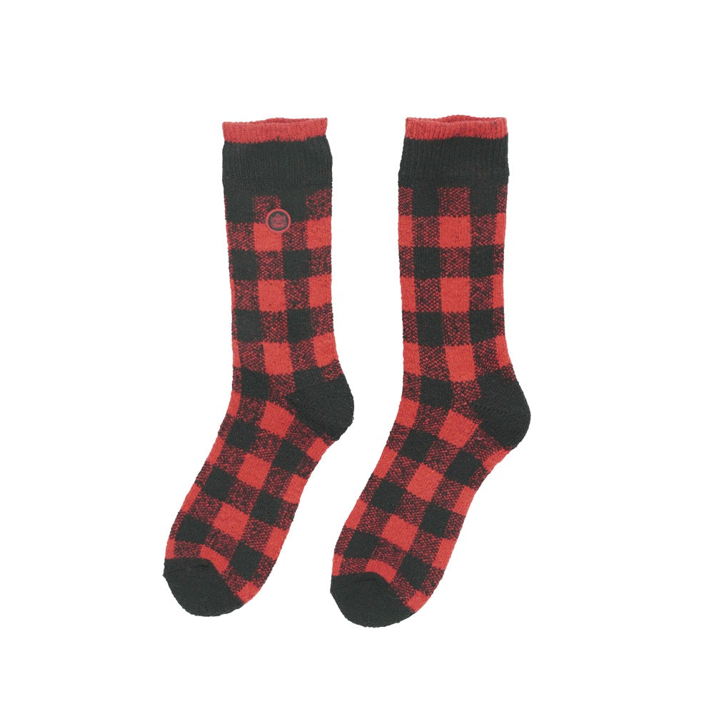 Red and black checkered socks on a white background