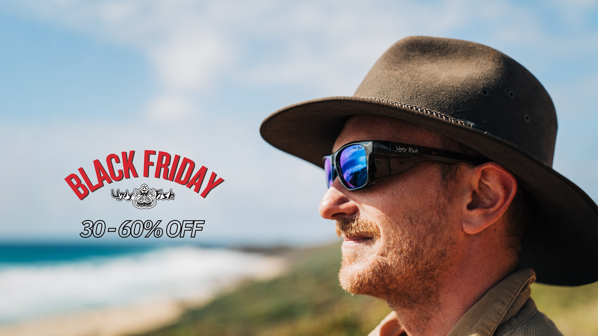 Man wearing a hat and sunglasses with a Black Friday sale banner in the background
