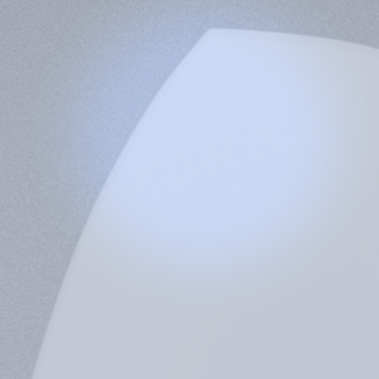A close-up of a blue light lens on a white surface, showing its clarity and reflective quality.